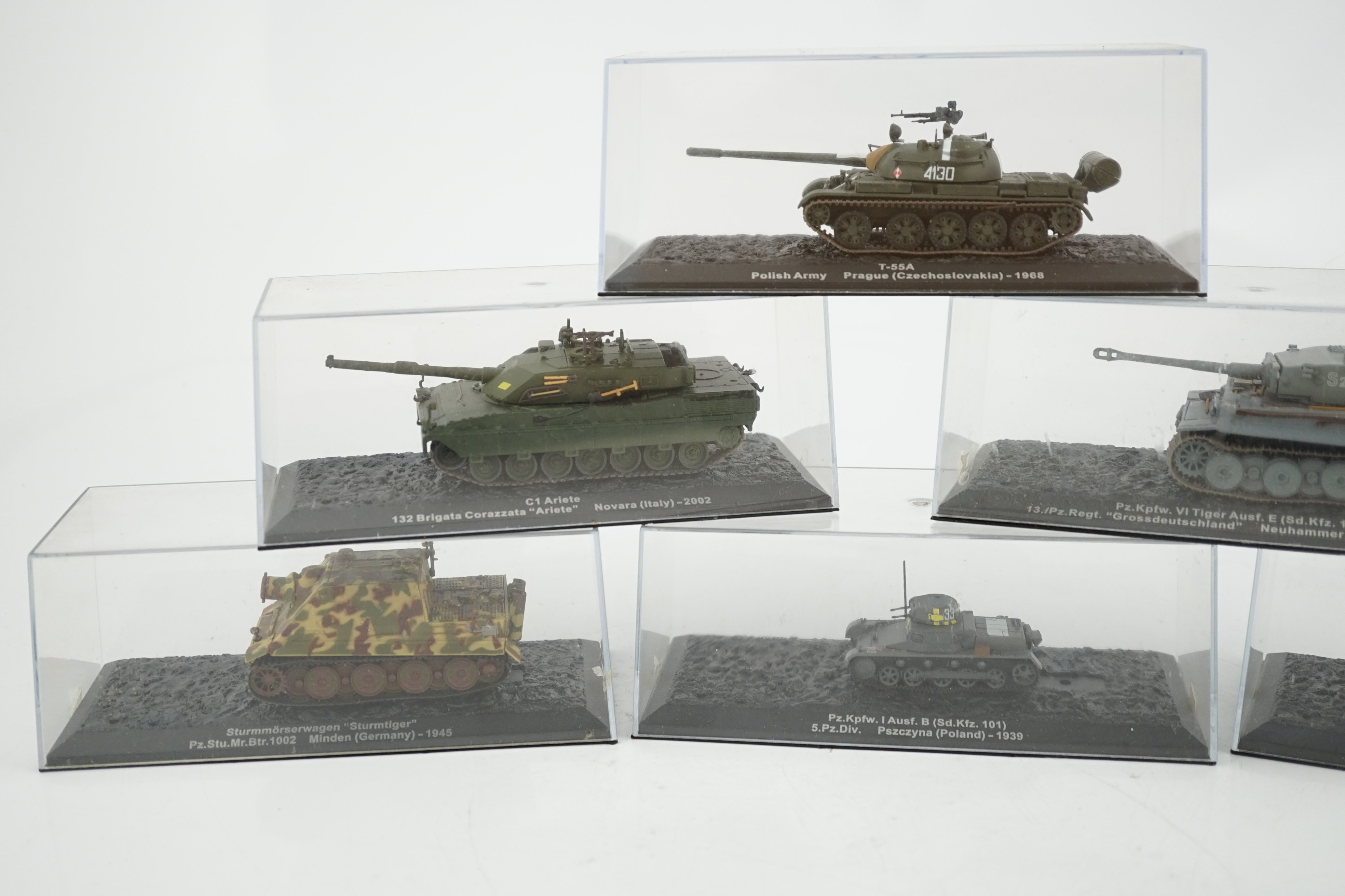 Sixty-eight magazine issue military vehicles in plastic display cases, including; tanks, armoured cars, personnel transporters, etc.